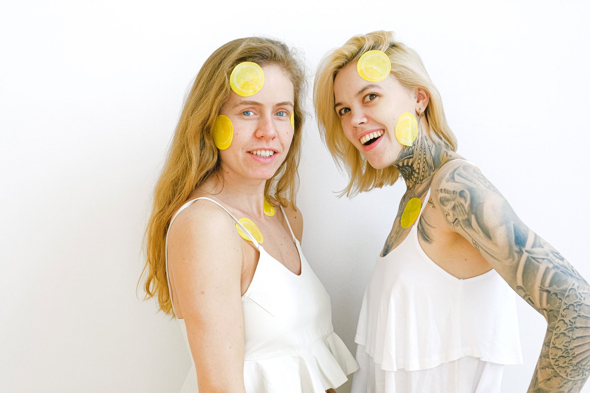 Bright yellow lemons arranged on a soft green background